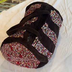 Embellished brown corduroy duffle bag